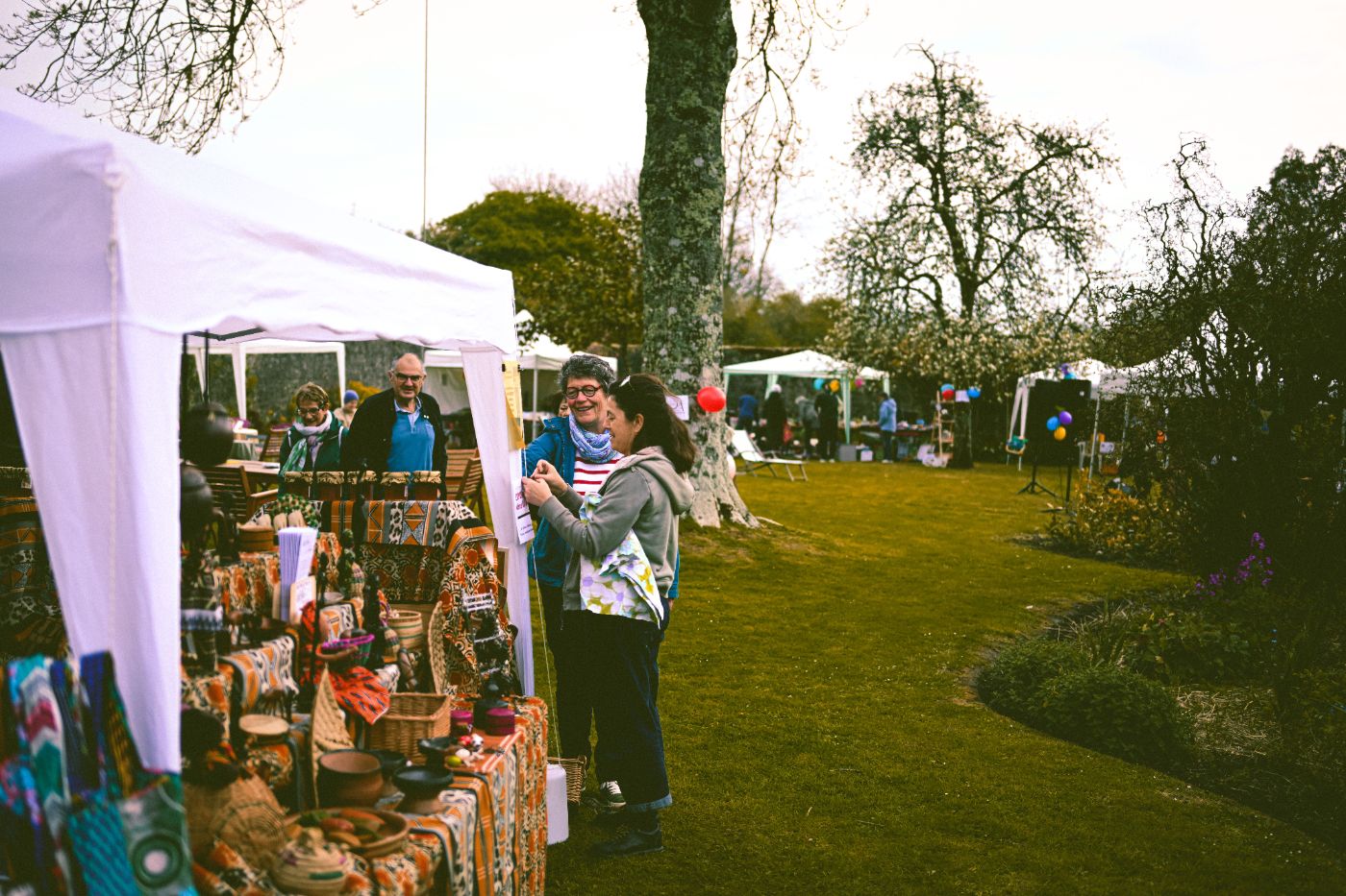 Vendor booths at an outdoor fall festival in a Gwinnett park
