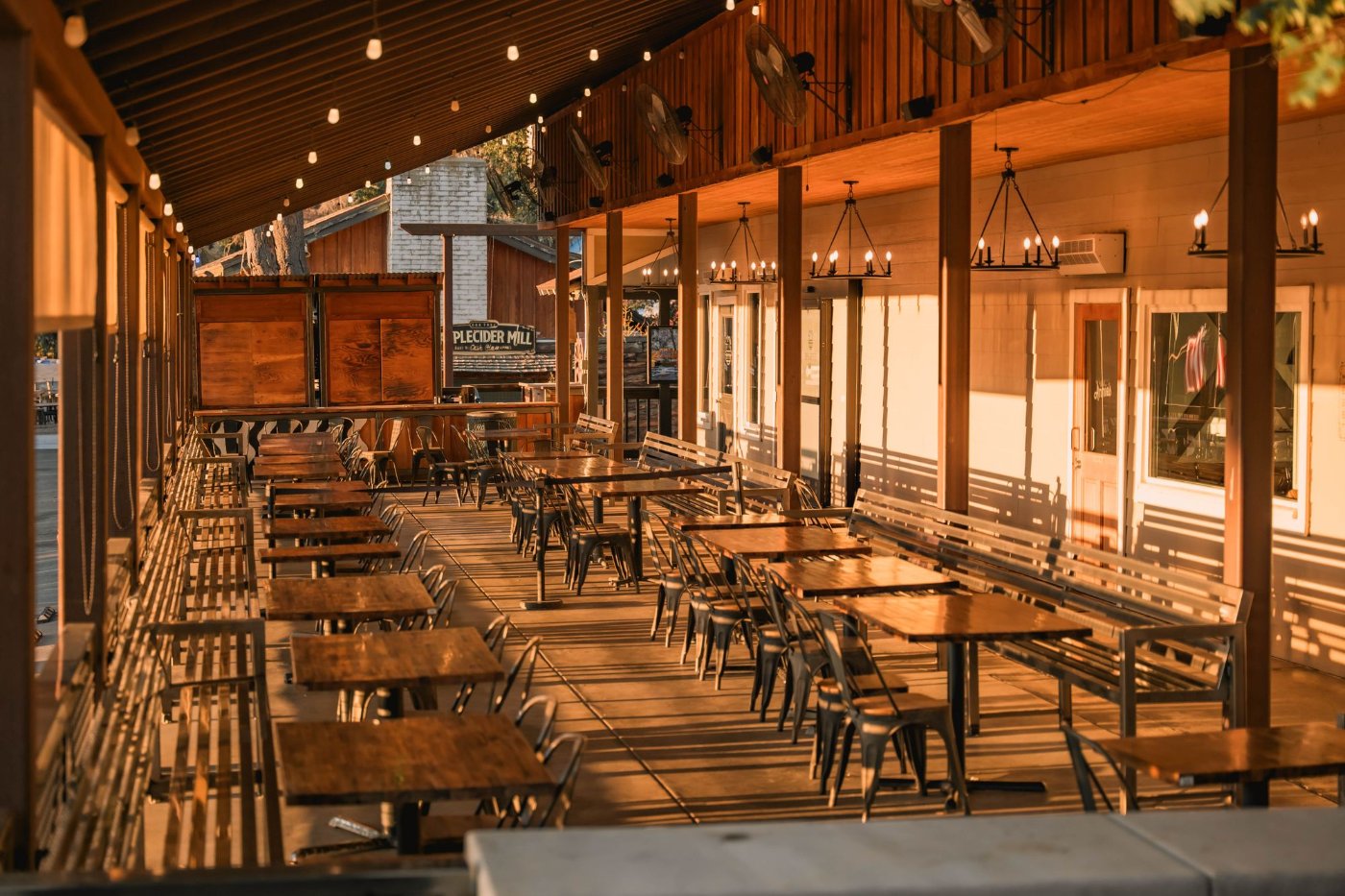 An outdoor restaurant patio with tables set for dining, representative of downtown Norcross's dining scene